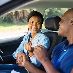 Girl that passes her driving test in car